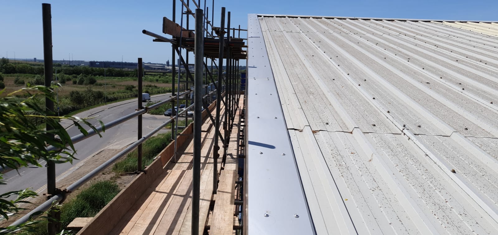 Repair of office section of a large Warehouse roof in Rainham, Essex
