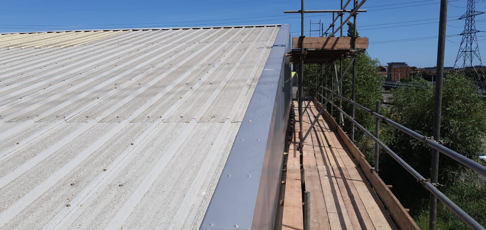 Repair work on the office section of a large Warehouse roof in Rainham, Essex