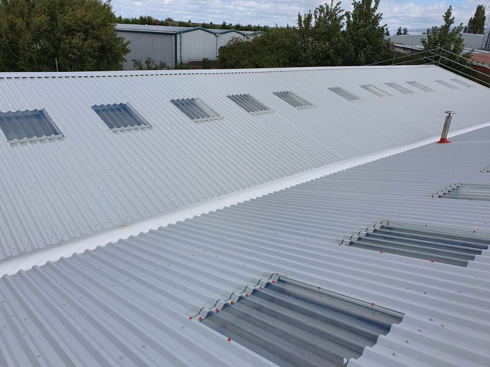 over-roofing to a warehouse roof in, Chichester, West Sussex