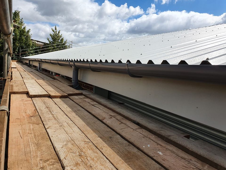 over roofing to warehouse roof in, Chichester, West Sussex