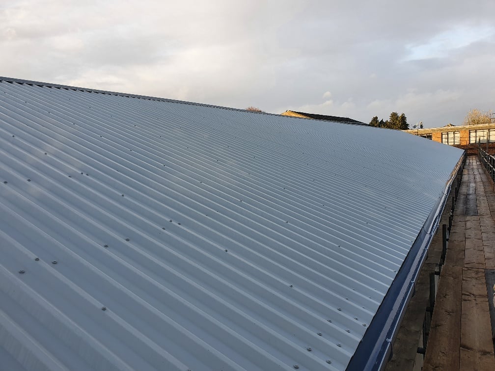Over roofing to a factory roof in Hersham Surrey