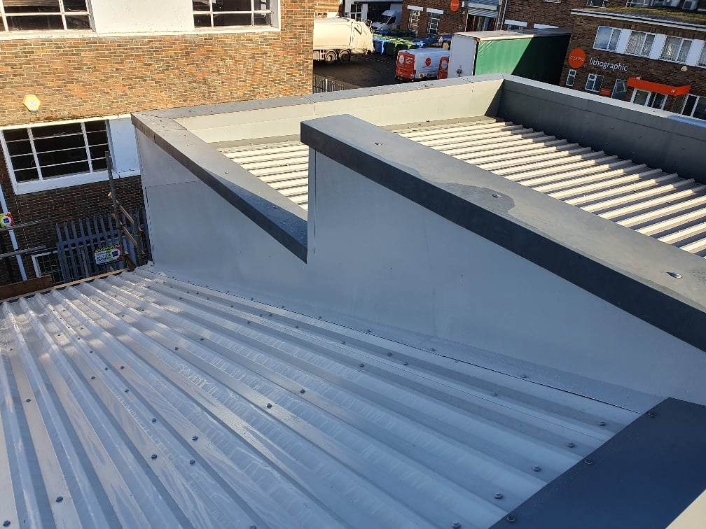 Warehouse over-roofing to an old roof in Hersham Surrey