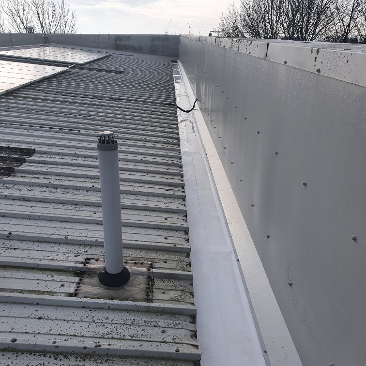 repair work to the guttering on a warehouse and office roof in Hove West Sussex