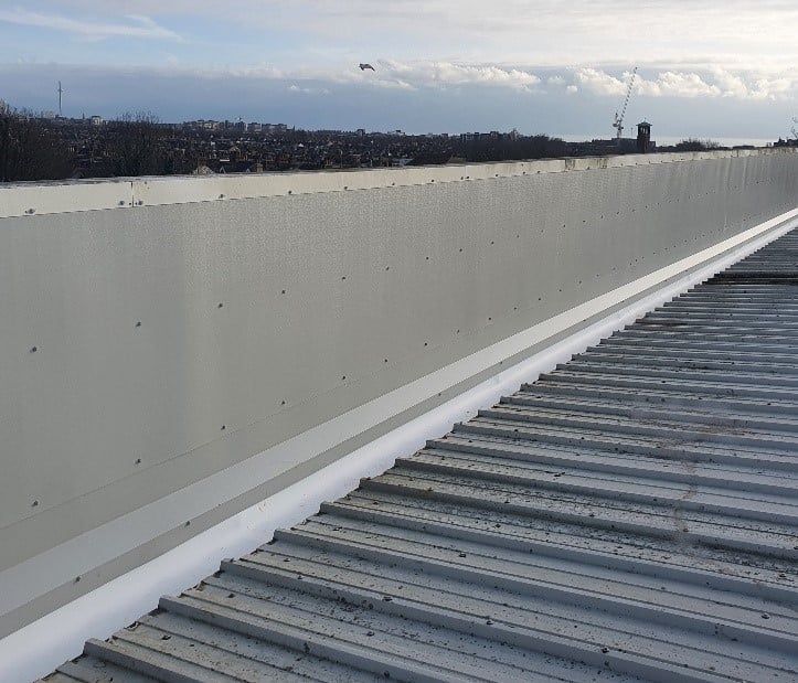 gutter repair on a warehouse and office roof in Hove West Sussex