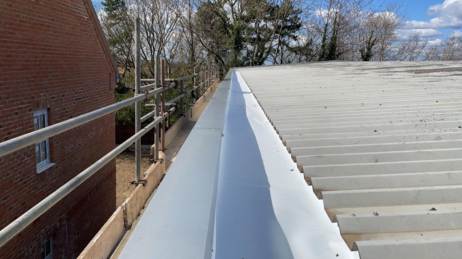 Repair work to a warehouse and office roof in Tadworth Surrey