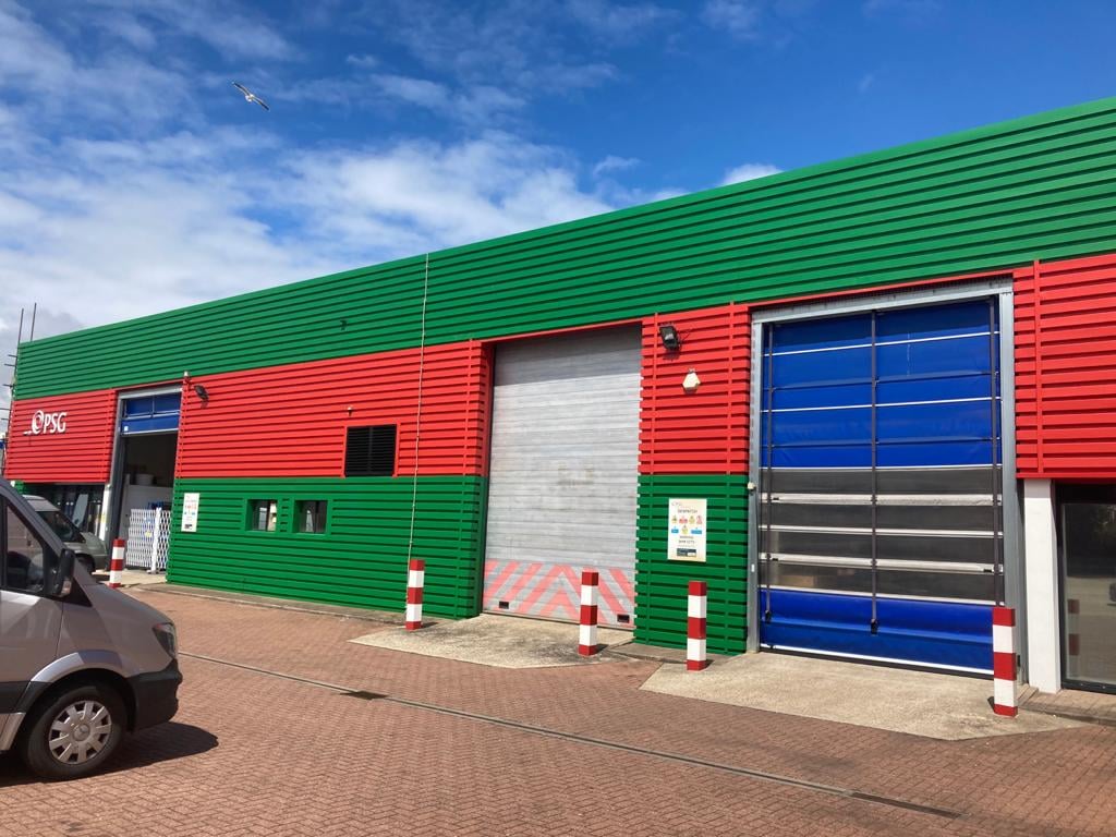 painting works to the cladding on a Factory warehouse in Worthing West Sussex