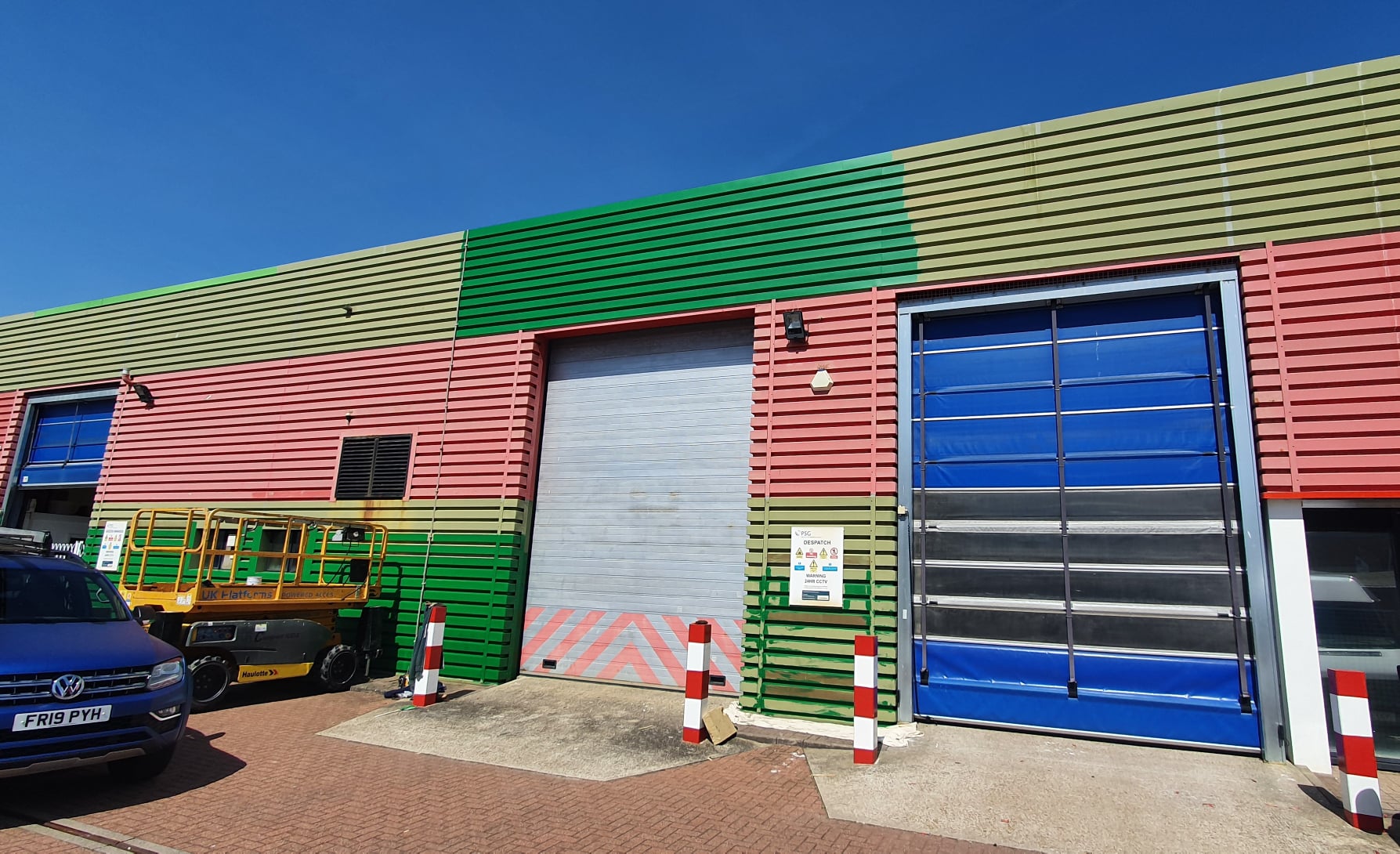 Cladding painting on a Factory warehouse in Worthing West Sussex