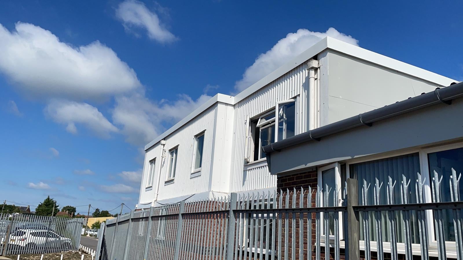 Coping flashings repairs on a flat office roof in Chichester West Sussex