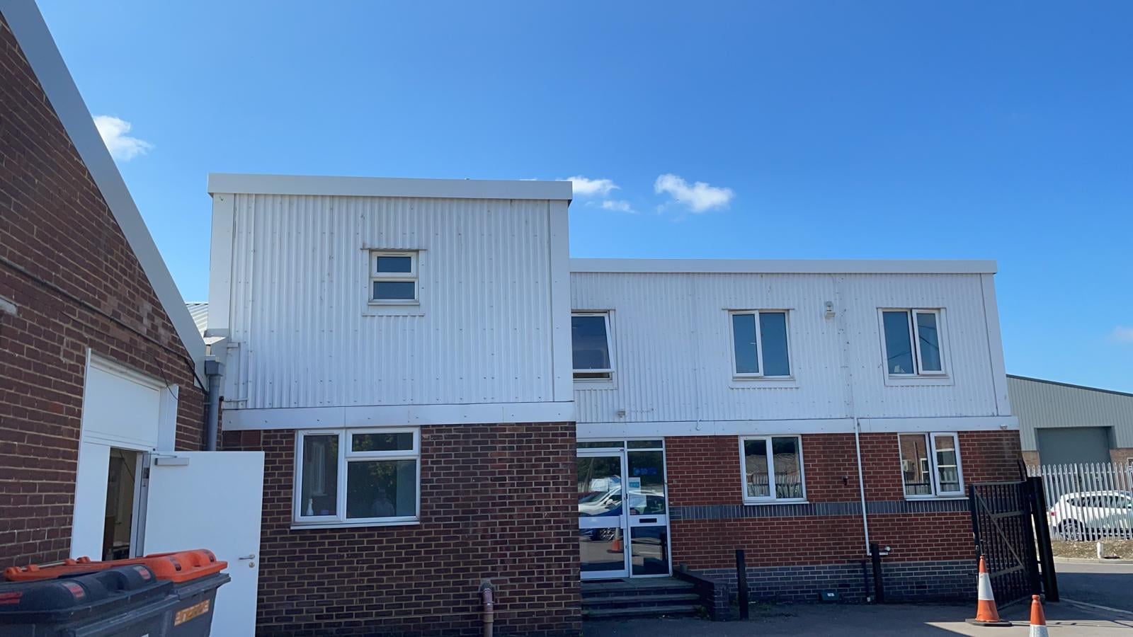 Repairs to the coping flashings on a flat office roof in Chichester West Sussex