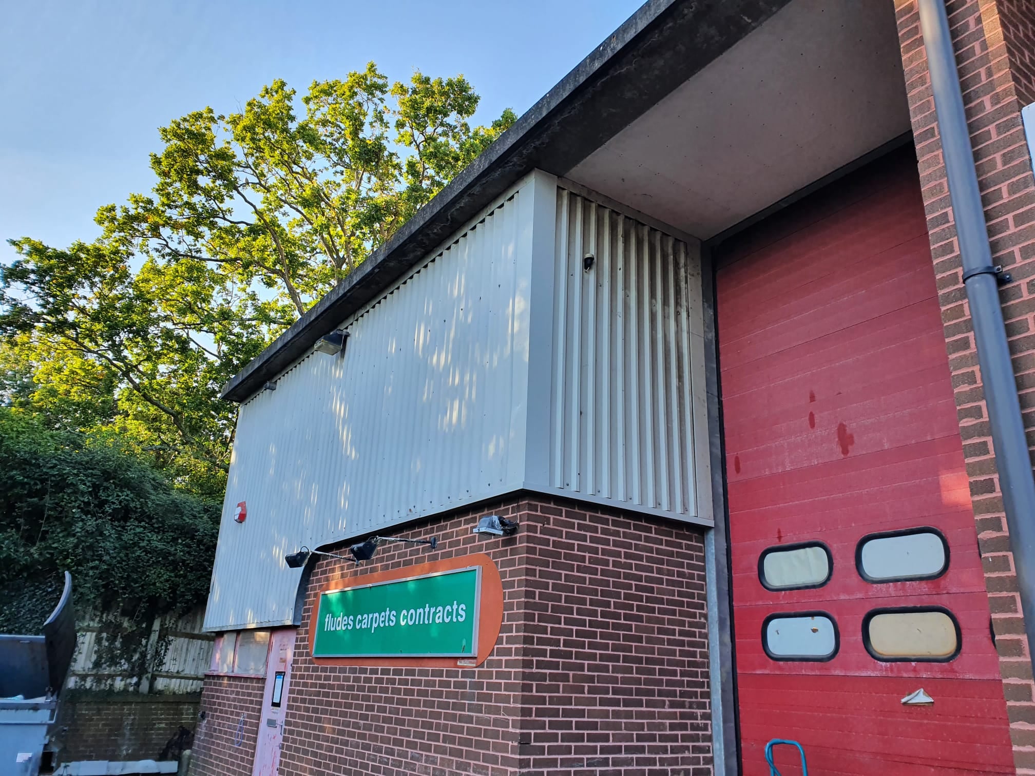 Repairs to damaged flashings on vertical cladding on a block of Units in Burgess Hill West Sussex