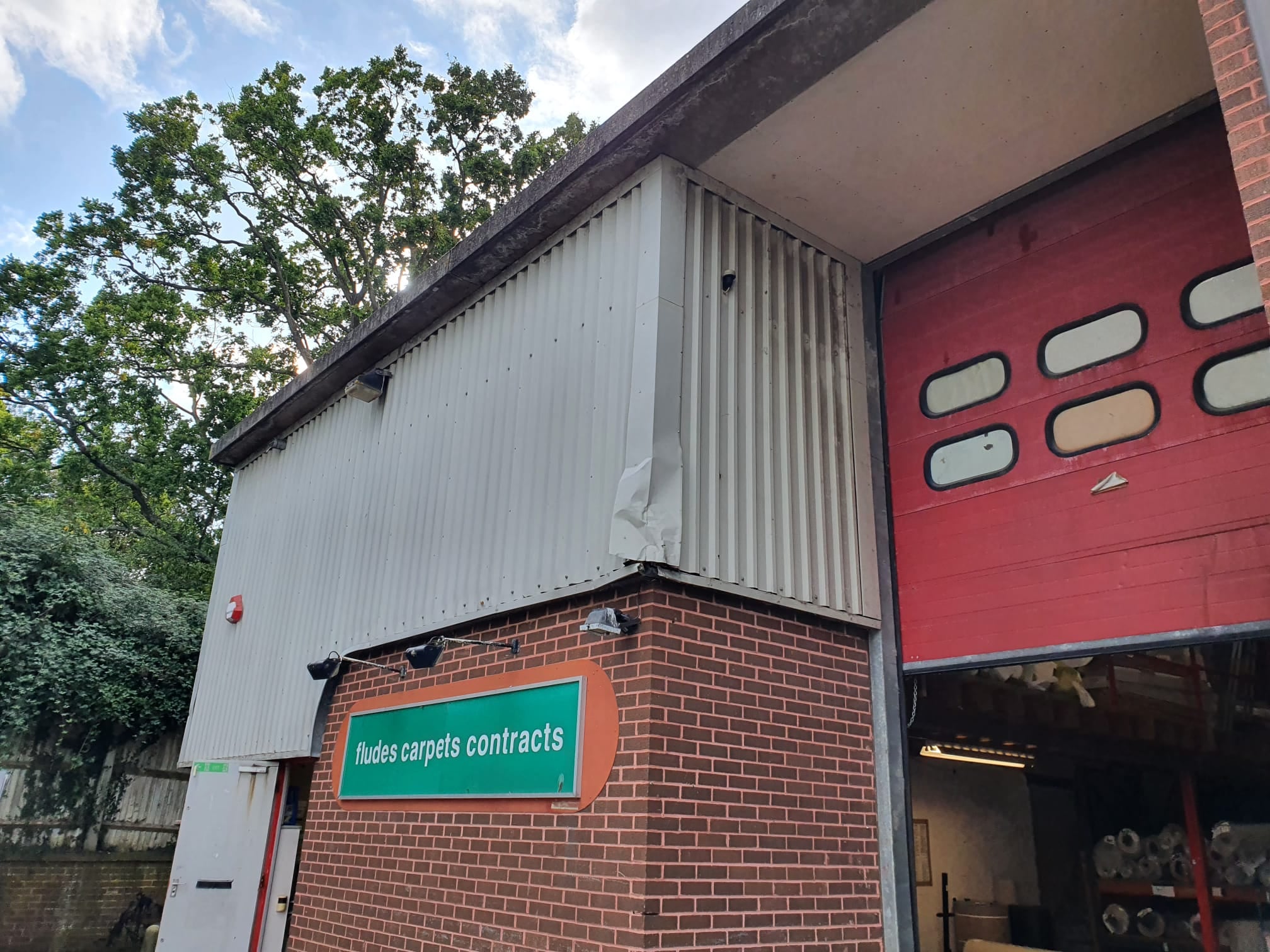 Repairs to flashings on vertical cladding on a block of Units in Burgess Hill West Sussex