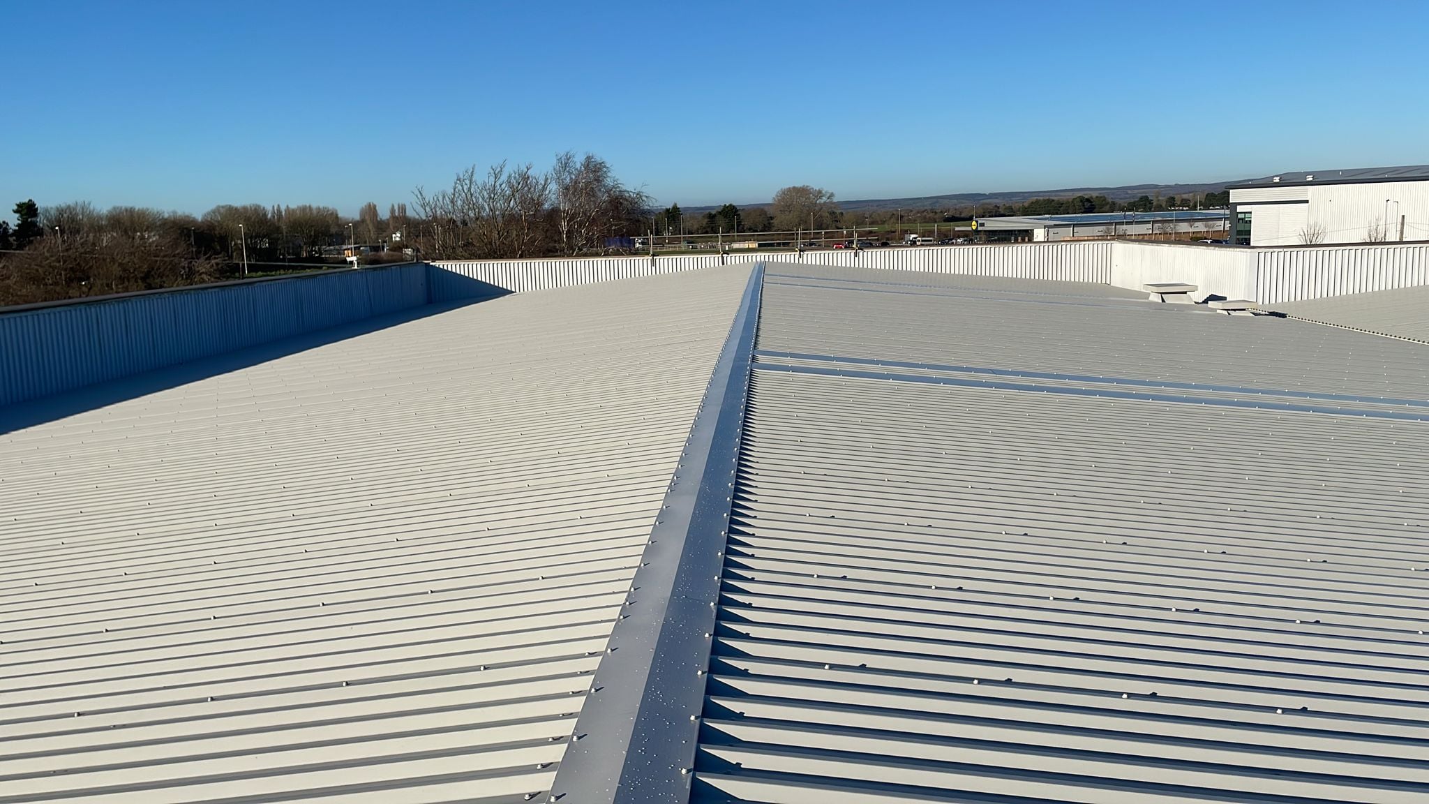Over-roofing project to an office and workshop roof in Bognor Regis, West Sussex