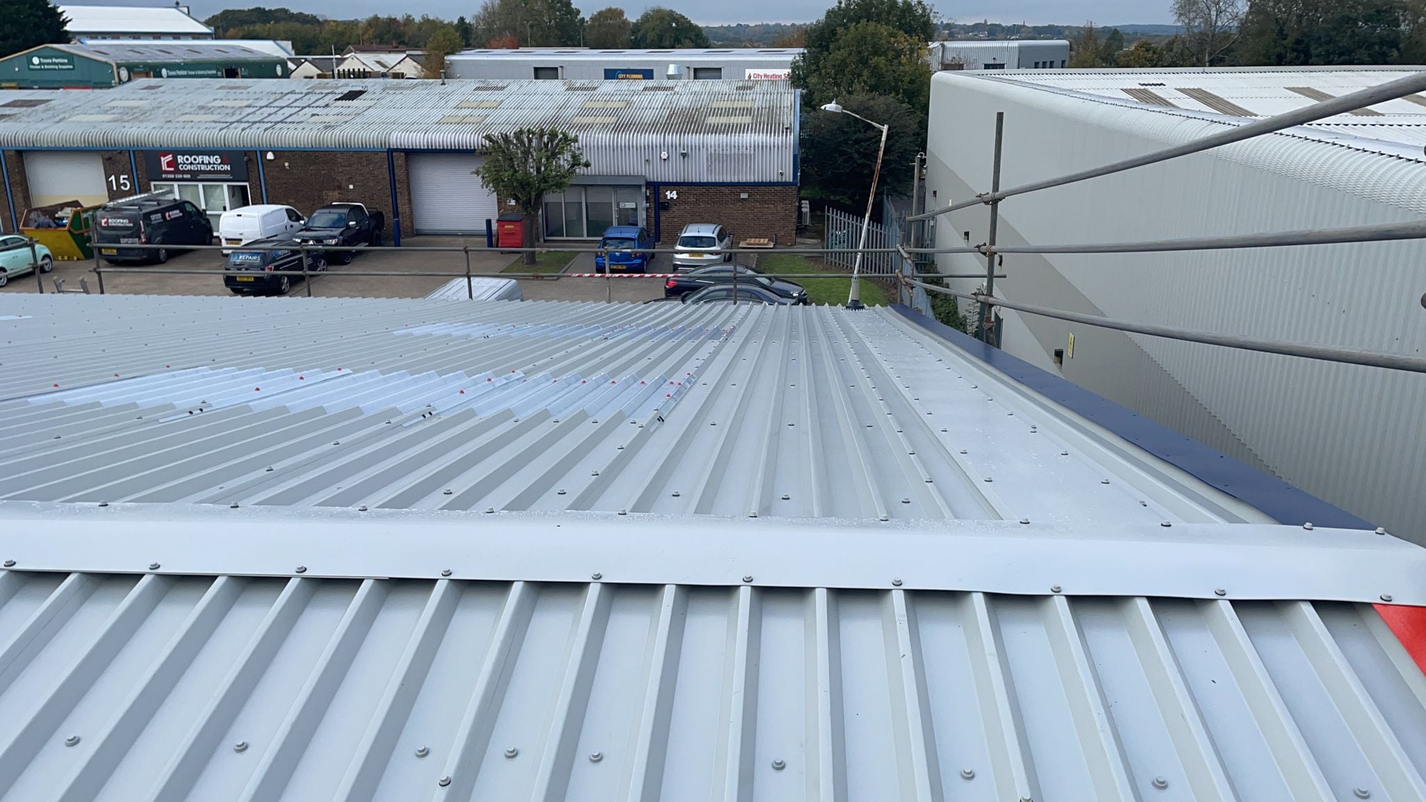 Over roofing to an office and warehouse in Laindon Essex with Rooflights