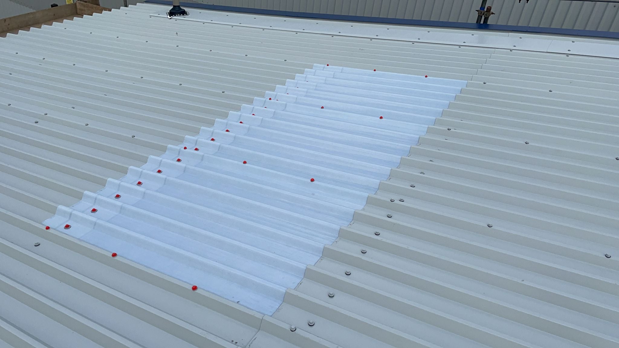 Over roofing to a warehouse roof in Laindon Essex