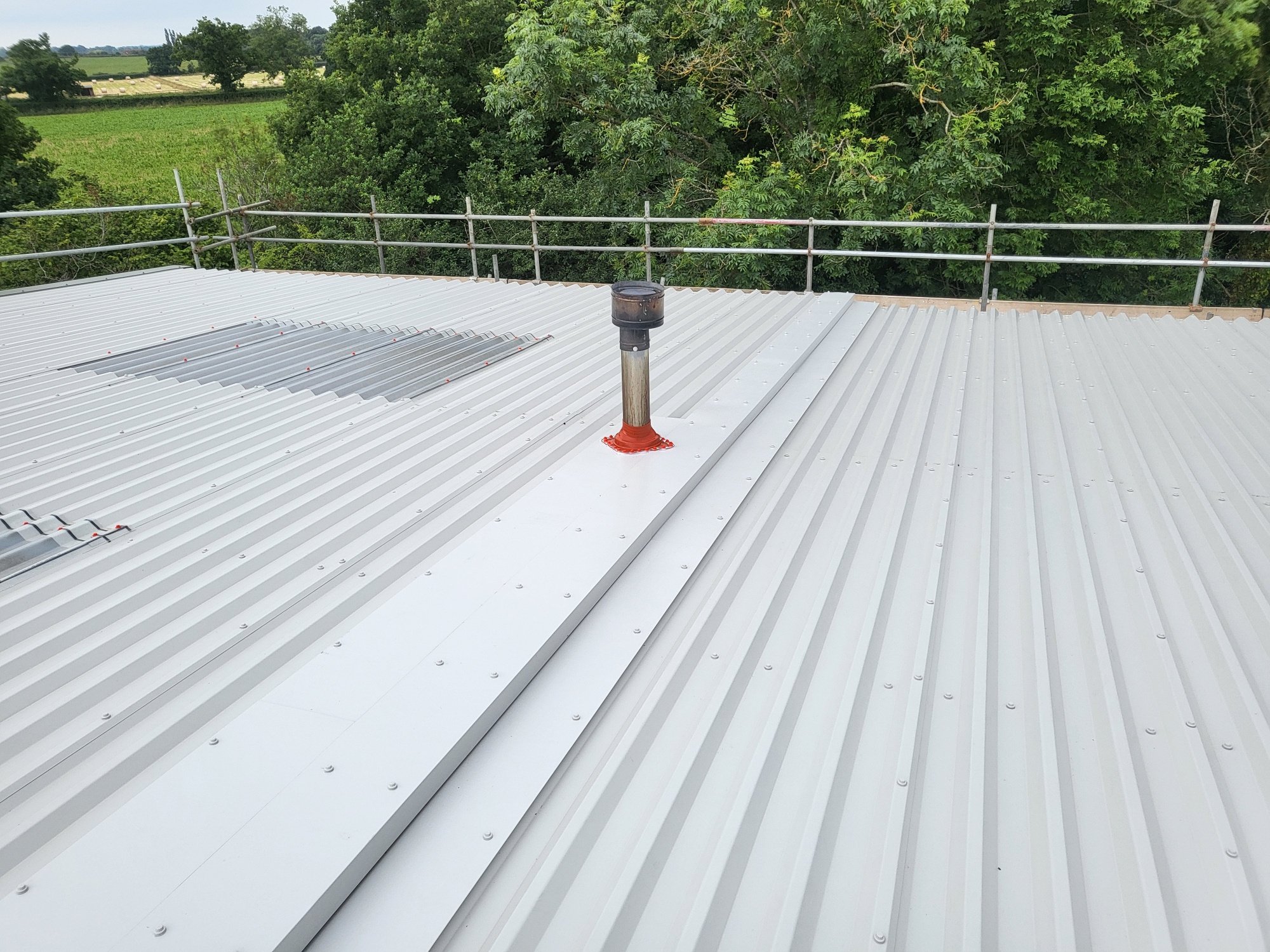 over-roofing to an office and warehouse roof in Partridge Green Horsham