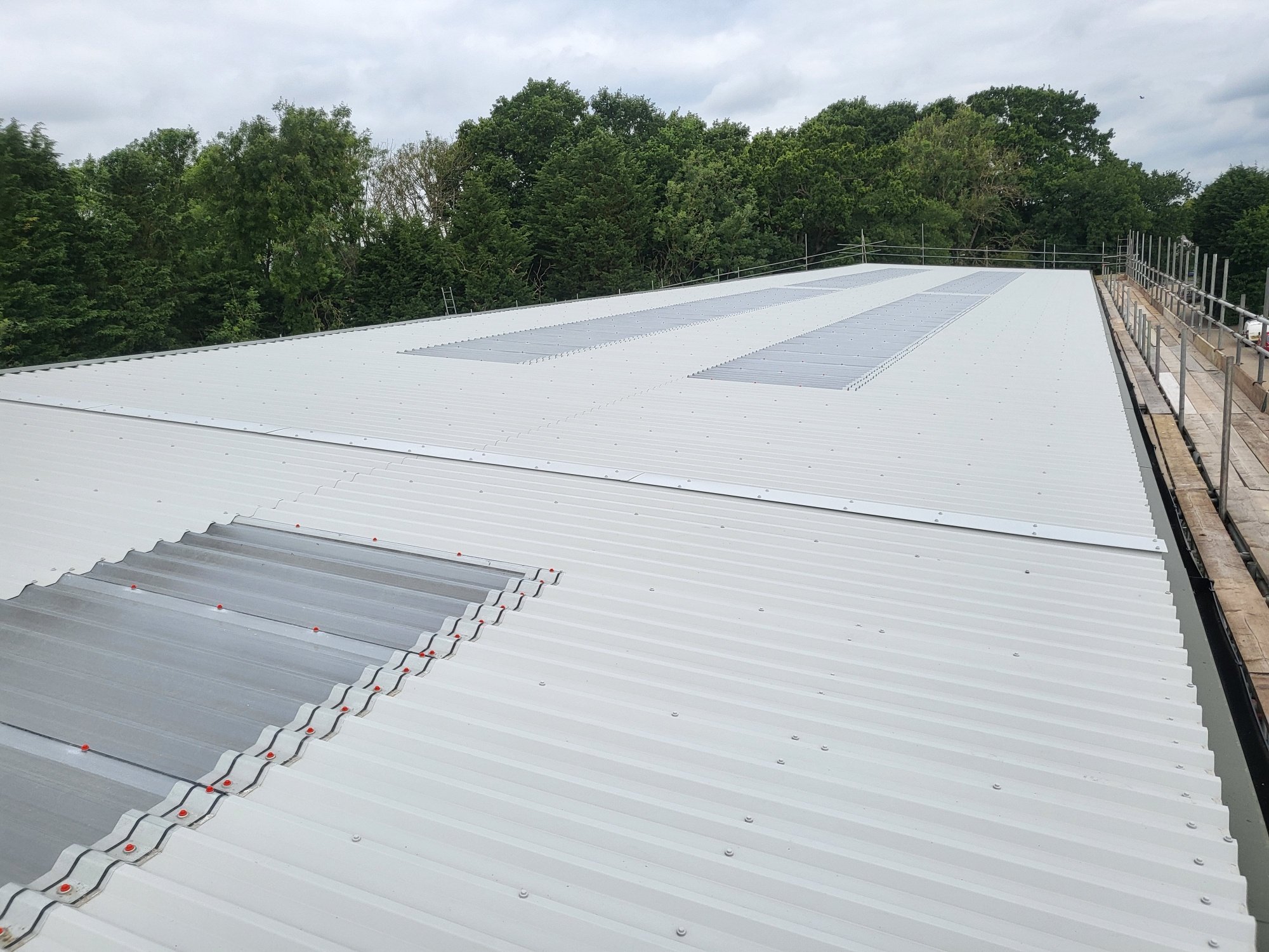over-roofing to an office and warehouse roof in Partridge Green