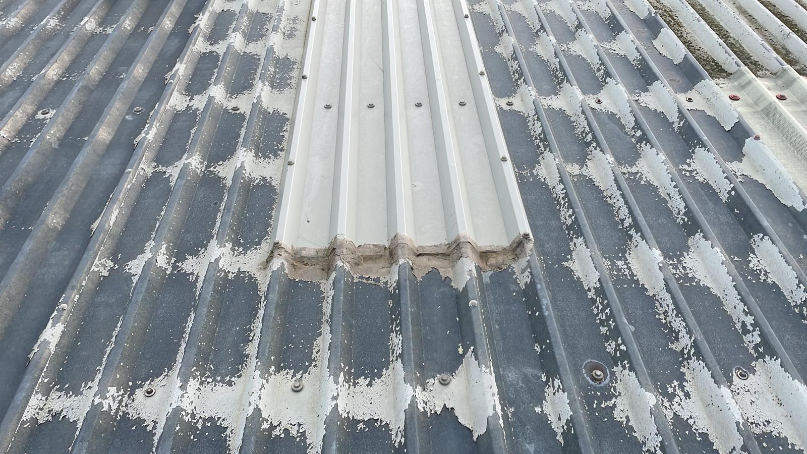 New ski-slope flashings repair to a warehouse roof in Salford, Redhill, Surrey