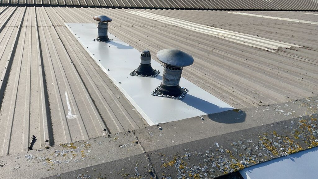 Leaks were occurring around the pipes to a warehouse roof in Aylesford Kent