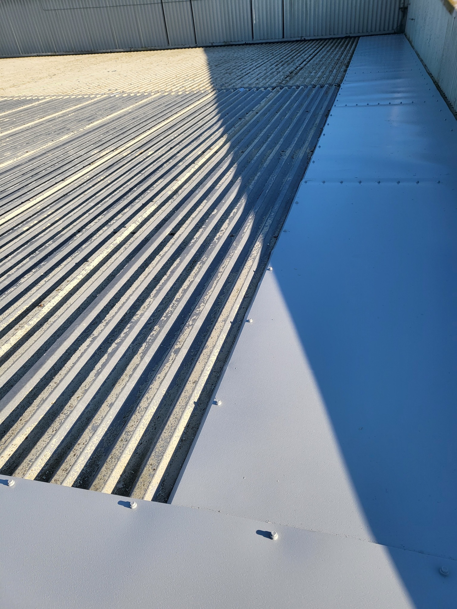 Roof repairs to a warehouse roof in Ashford, Kent