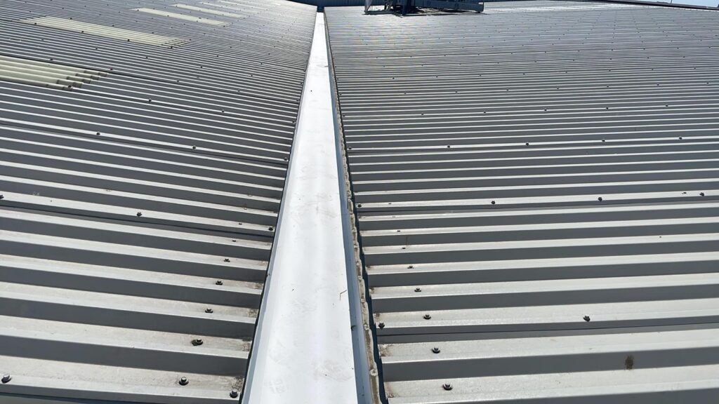 repairs to a valley gutter serving an office and workshop roof in Bognor Regis, West Sussex