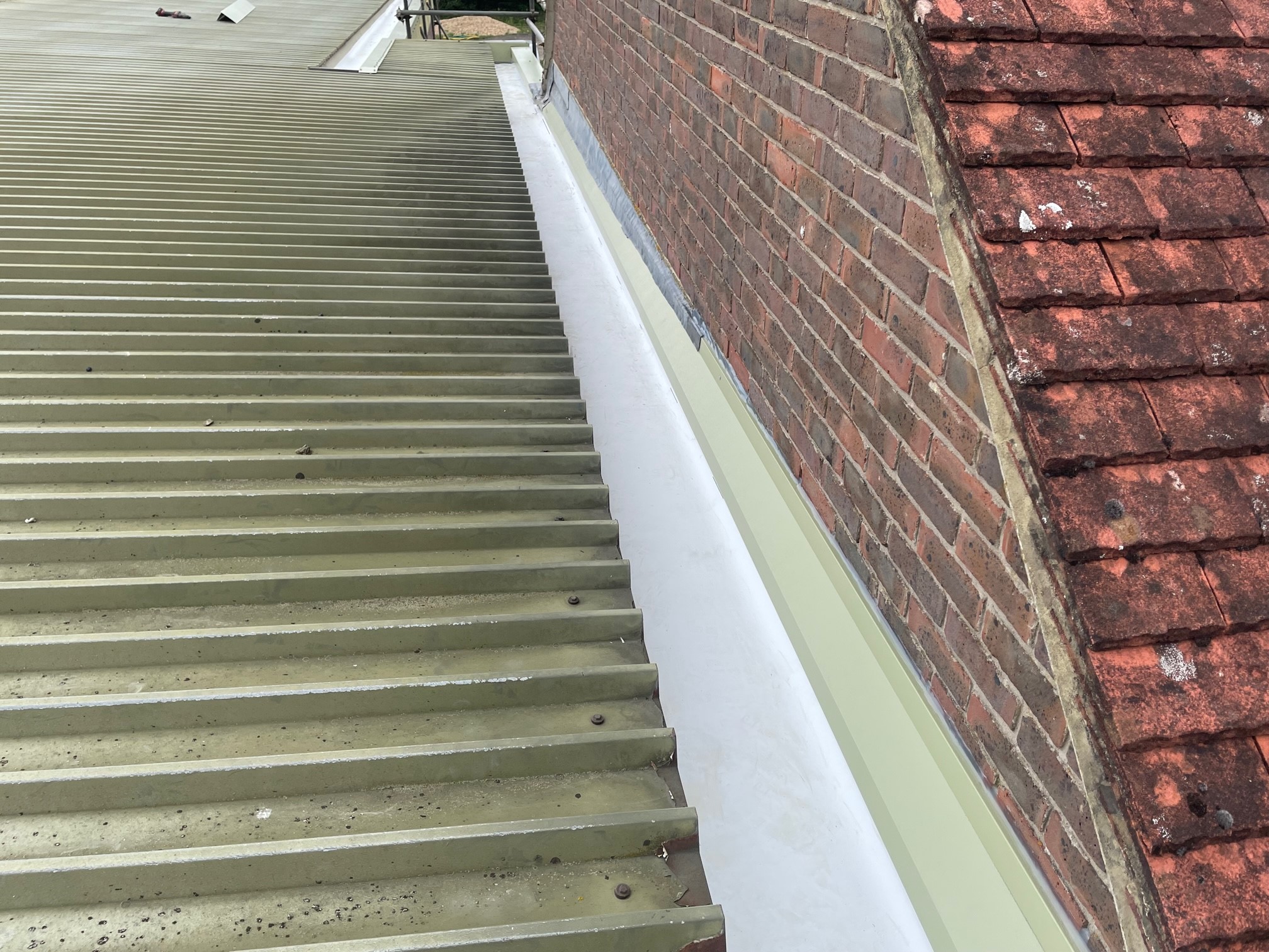 Gutter repairs at the Academy at a golf club in Slinfold, Horsham, West Sussex