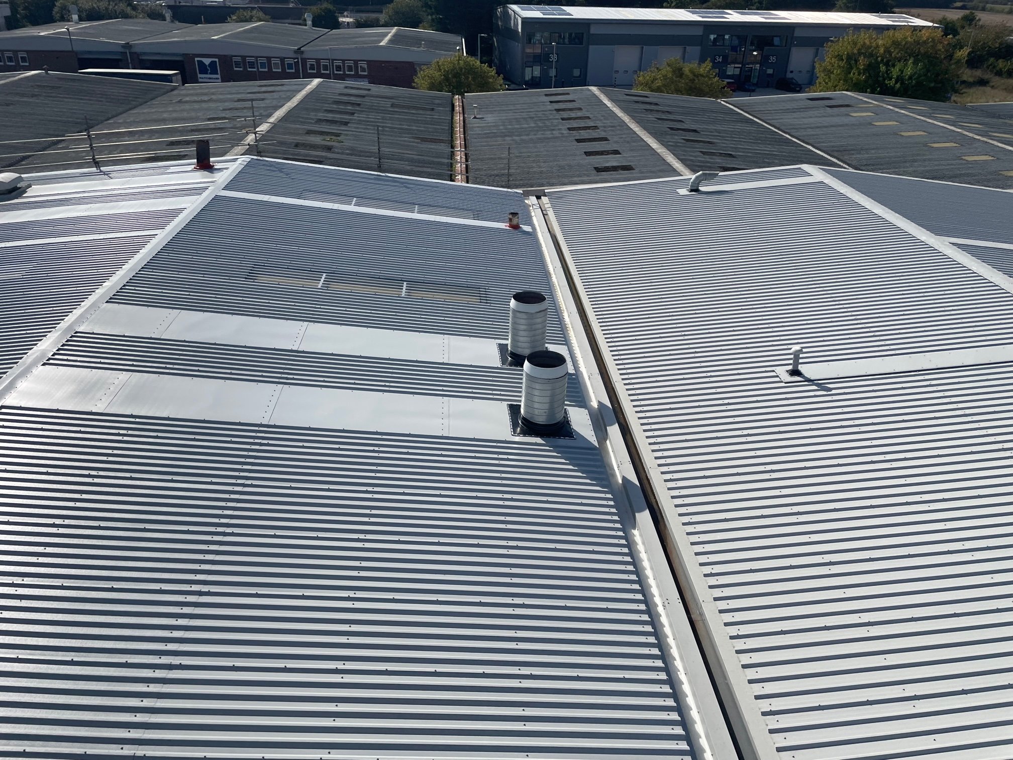 over roofing to a warehouse roof in Littlehampton West Sussex