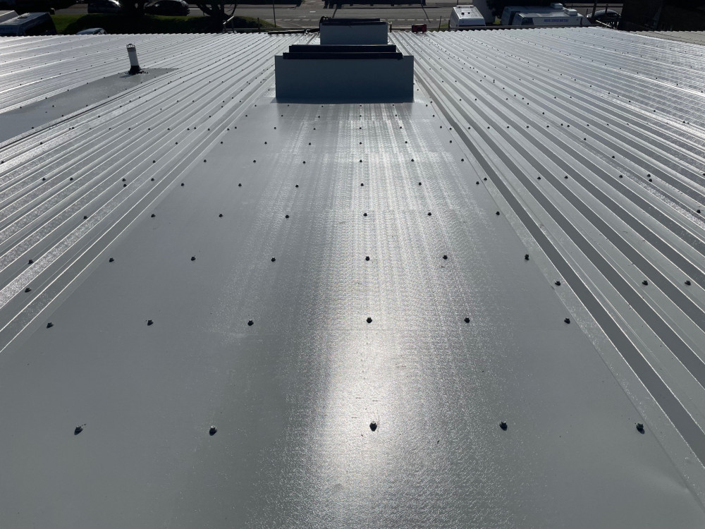 Over-roofing to a warehouse office roof in Worthing, West Sussex