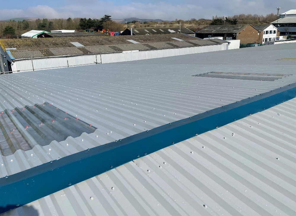Over-roofing to a warehouse roof in Worthing, West Sussex