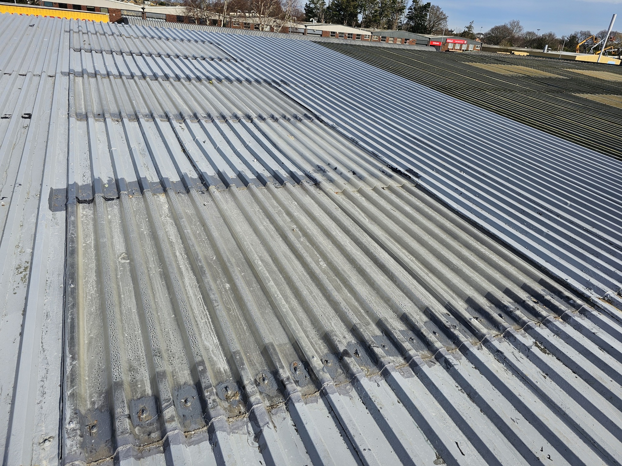 Over-roofing projects on a Warehouse and office roof in Hailsham, East Sussex