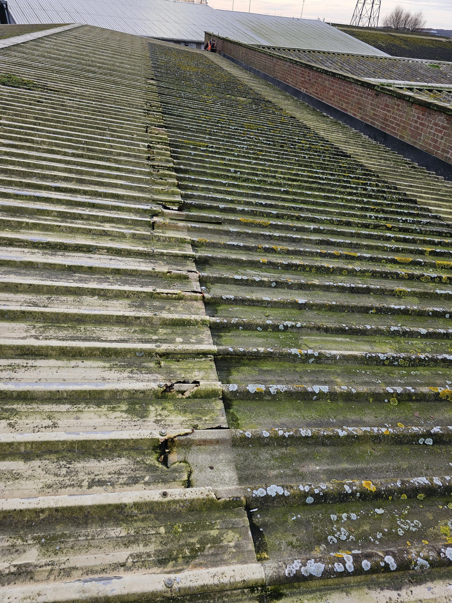 over-roofing to 2 no. slopes of a warehouse roof in Newhaven