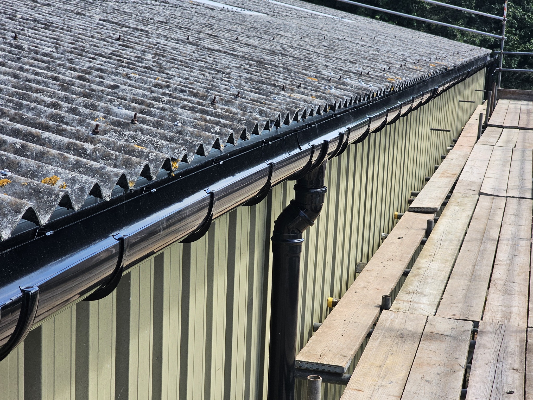 Guttering to a warehouse and stores roof in Chichester, West Sussex
