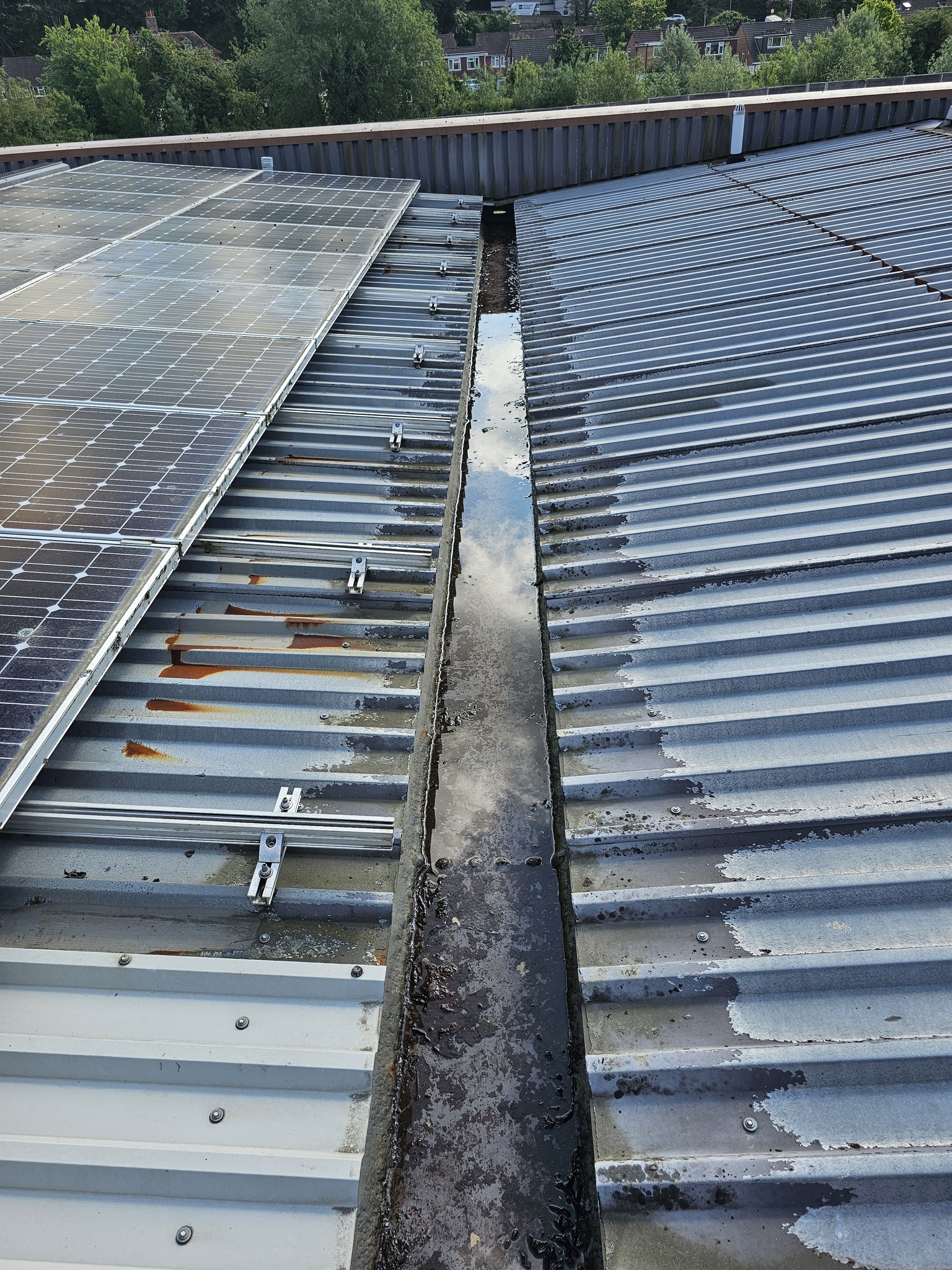 Roof repairs to gutters serving an industrial Unit and workshop in Lewes, East Sussex
