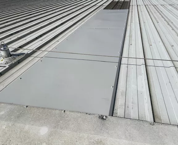 Roofing repairs to a warehouse roofs in Salfords, Redhill, Surrey