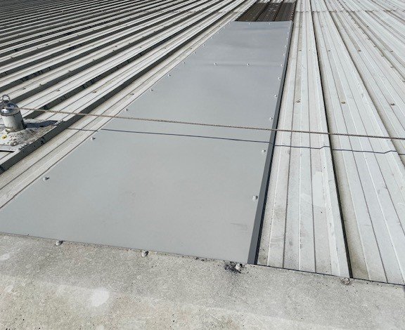Roofing repairs to a warehouse roofs in Salfords, Redhill, Surrey