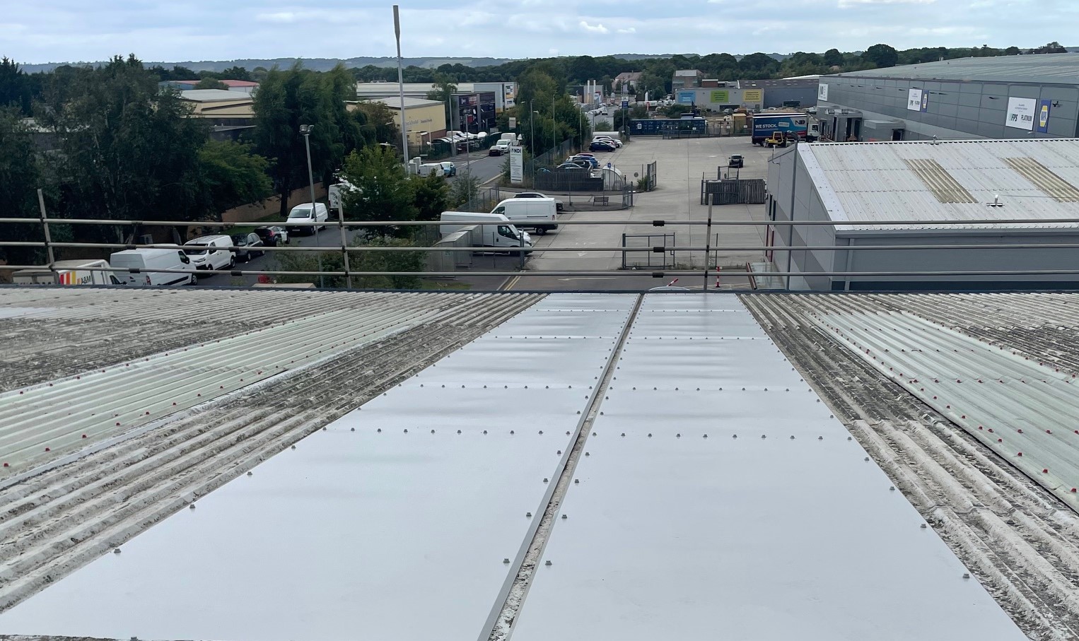 Gutter repairs over the offices and warehouse of an industrial unit in Maidstone, Kent