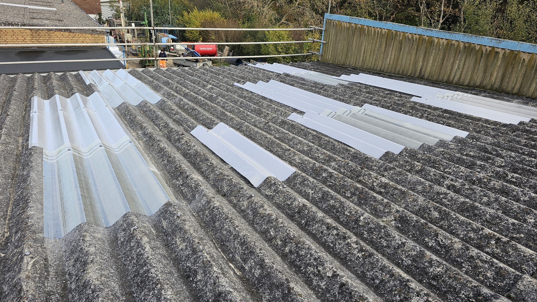 Replaced translucent roof sheets on a workshop roof in East Grinstead