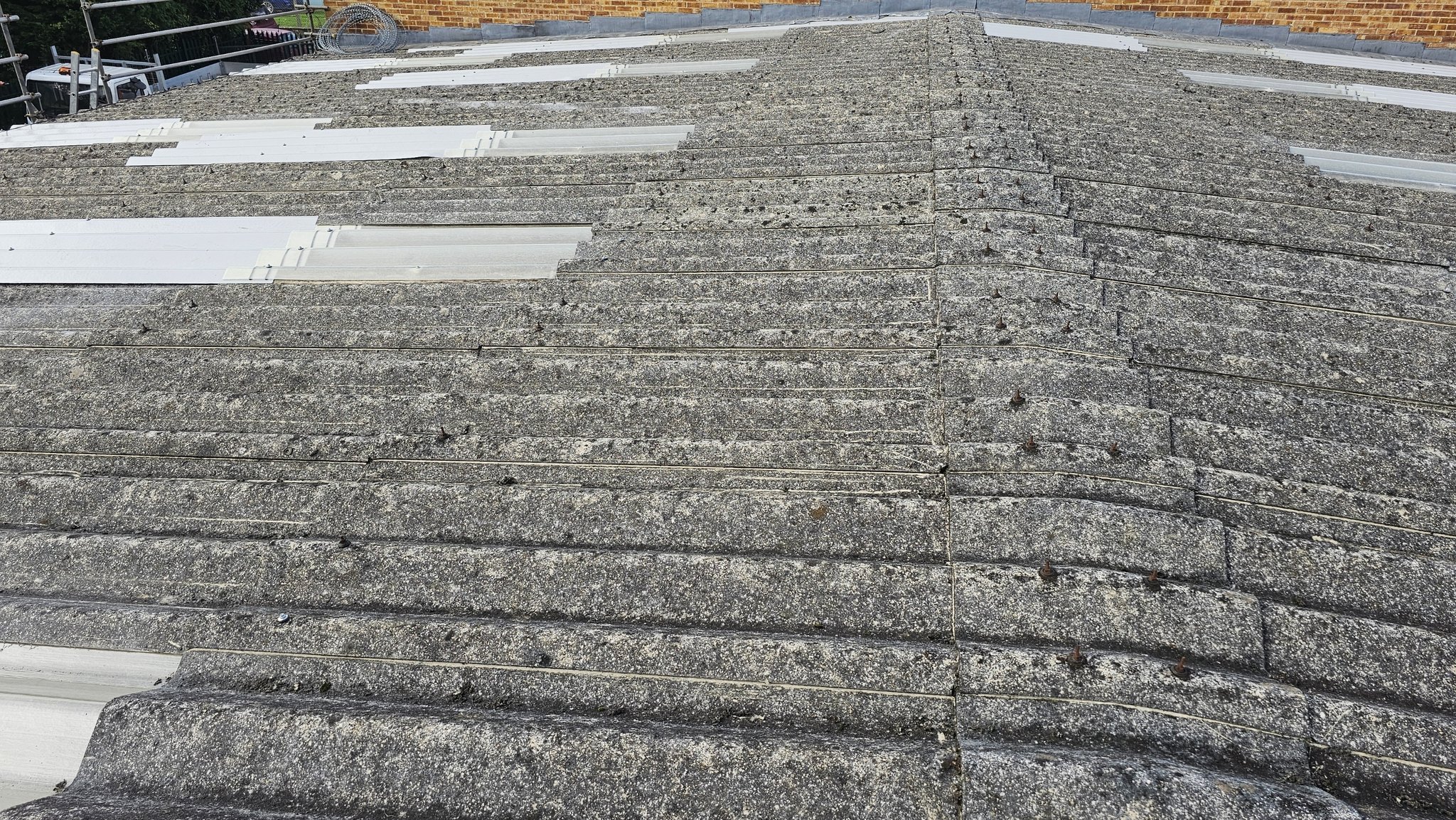 Replaced translucent roof sheets on a workshop roof in West Sussex