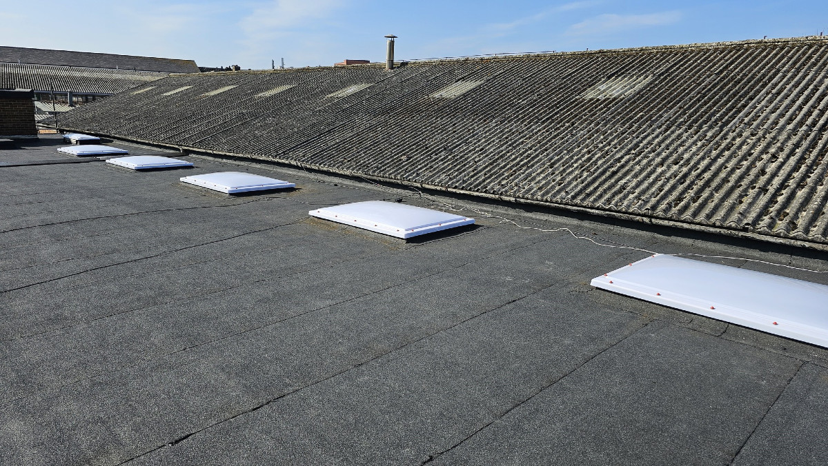 Felting works and roof lights to a workshop roof in Dartford, Kent