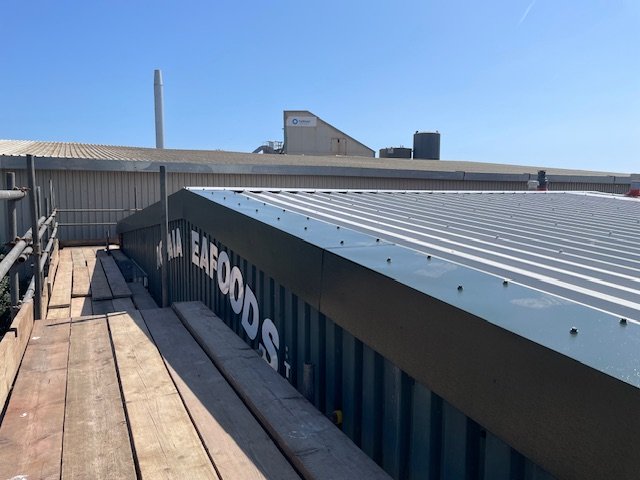 over-roofing to an office and shop roof in Sussex