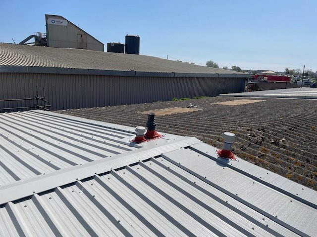 over-roofing to an office and shop roof in West Sussex