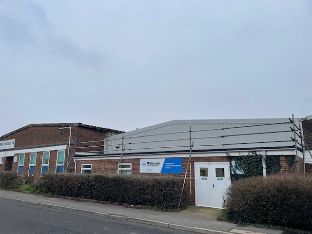 Over-cladding to a warehouse wall near Littlehampton, West Sussex